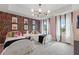 Whimsical bedroom with colorful accent wall, two twin beds, and bright natural light from the large window at 420 Hatcher Ct, Hampton, GA 30228