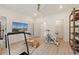 Bright gym with exercise equipment, mirrors, and seamless flow to adjacent rooms and ample storage at 420 Hatcher Ct, Hampton, GA 30228