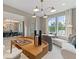 Bright living room featuring stylish decor, wooden desk, and seamless connection to the dining area at 420 Hatcher Ct, Hampton, GA 30228