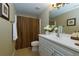 Bathroom featuring a vanity, mirror, tile flooring, and shower with curtain at 5009 Preservation Pointe Nw, Kennesaw, GA 30152