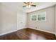 Bright bedroom offering hardwood floors, a ceiling fan, and natural light at 1554 Pine Ct, Conley, GA 30288