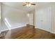 Bedroom featuring dark hardwood floors and bright closet doors at 1554 Pine Ct, Conley, GA 30288