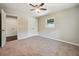 Neutral bedroom with carpet, ceiling fan, and a double closet at 1554 Pine Ct, Conley, GA 30288
