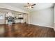 Spacious living room is open to the kitchen, showcasing gleaming hardwood floors at 1554 Pine Ct, Conley, GA 30288