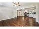 Bright living room open to kitchen features gleaming hardwood floors and contemporary finishes at 1554 Pine Ct, Conley, GA 30288