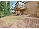 Spacious backyard featuring a two-story deck and lush greenery at 2982 Huntshire Pl, Atlanta, GA 30340