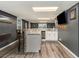 Finished basement featuring a wet bar area, countertop seating, and neutral flooring at 2982 Huntshire Pl, Atlanta, GA 30340