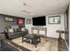 Finished basement featuring a large seating area and television at 2982 Huntshire Pl, Atlanta, GA 30340