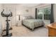 Bright bedroom featuring exercise equipment, neutral tones, and carpet at 2982 Huntshire Pl, Atlanta, GA 30340