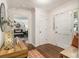 Inviting entryway with hardwood floors, white walls, and a view into the living room, showcasing elegant details at 2982 Huntshire Pl, Atlanta, GA 30340