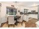 Eat-in kitchen features white cabinets and granite countertops at 2982 Huntshire Pl, Atlanta, GA 30340