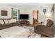 Cozy living room featuring hardwood floors, plush seating, and natural light, creating a welcoming atmosphere at 2982 Huntshire Pl, Atlanta, GA 30340