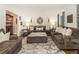 Comfortable living room with plush sofas, decorative rug, and ample lighting, perfect for relaxing at 2982 Huntshire Pl, Atlanta, GA 30340