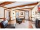 Inviting living room featuring wood trim, beams, and large windows at 2982 Huntshire Pl, Atlanta, GA 30340