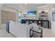 Bright living room with a TV, beverage cooler, and modern decor at 424 Hatcher Ct, Hampton, GA 30228