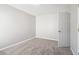 Cozy bedroom with gray carpet, neutrally painted, and single door entrance at 4677 Creekside Cv, Atlanta, GA 30349