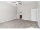 Spacious bedroom with a ceiling fan and an attached bathroom in neutral colors at 4677 Creekside Cv, Atlanta, GA 30349