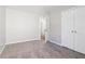 Bedroom with doorway to other room and double door closet for storage at 4677 Creekside Cv, Atlanta, GA 30349