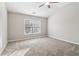 Bright bedroom with a ceiling fan, neutral walls, and a window with natural light at 4677 Creekside Cv, Atlanta, GA 30349