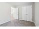 Bedroom featuring a double door closet and doorway access to other rooms at 4677 Creekside Cv, Atlanta, GA 30349