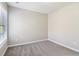 Bright bedroom with gray carpet, natural light, and freshly painted walls at 4677 Creekside Cv, Atlanta, GA 30349