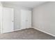 Bedroom with carpeting and double door closet; freshly painted and move in ready at 4677 Creekside Cv, Atlanta, GA 30349