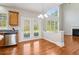 Cozy breakfast area with hardwood floors, a chandelier, and view to the living room at 4677 Creekside Cv, Atlanta, GA 30349