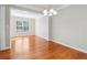Bright dining room features hardwood floors, neutral paint, and lots of natural light at 4677 Creekside Cv, Atlanta, GA 30349