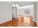 Bright dining room features hardwood floors, neutral paint, and an open transition at 4677 Creekside Cv, Atlanta, GA 30349