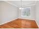 Bright dining room features hardwood floors, neutral paint, and lots of natural light at 4677 Creekside Cv, Atlanta, GA 30349