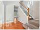 Bright foyer with hardwood floors and carpeted stairs leading to the second floor at 4677 Creekside Cv, Atlanta, GA 30349
