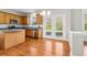 Kitchen features stainless steel appliances, wooden cabinets, and French doors to the backyard at 4677 Creekside Cv, Atlanta, GA 30349