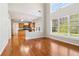 Bright, open-concept living area with hardwood floors and a view of the kitchen at 4677 Creekside Cv, Atlanta, GA 30349