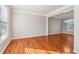 Spacious living room features hardwood floors, neutral paint, and lots of natural light at 4677 Creekside Cv, Atlanta, GA 30349