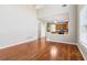 Open floor plan showcasing hardwood floors and view of the kitchen and breakfast area at 4677 Creekside Cv, Atlanta, GA 30349