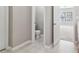 View into the powder room, with a toilet, gray walls, and a tile floor at 4677 Creekside Cv, Atlanta, GA 30349