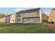 The rear of the house offers access to the yard and windows for viewing the outdoor space at 4677 Creekside Cv, Atlanta, GA 30349