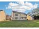Rear exterior with lots of windows overlooking an expansive green backyard perfect for entertaining at 4677 Creekside Cv, Atlanta, GA 30349