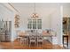 Cozy dining area with built-in seating, stylish decor, and hardwood floors at 776 Geneva Rd, Canton, GA 30114