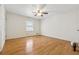 Spacious bedroom featuring hardwood flooring and a ceiling fan at 1532 Wethersfield Rd, Snellville, GA 30078