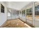 Enclosed sunroom with multiple windows and door to the exterior at 1532 Wethersfield Rd, Snellville, GA 30078