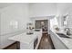 Spacious kitchen with modern design, white cabinetry, sleek island, and seamless transition to dining area at 185 E Wesley Ne Rd, Atlanta, GA 30305