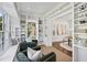 Bright sitting room featuring custom built-ins, seating, and an arched window providing natural light at 185 E Wesley Ne Rd, Atlanta, GA 30305