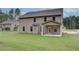 Expansive backyard with lawn and covered porch perfect for outdoor gatherings at 428 Hatcher Ct, Hampton, GA 30228