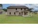 Large backyard with covered patio, and lush green grass at 428 Hatcher Ct, Hampton, GA 30228