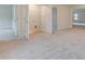 Hallway featuring multiple entry points and carpeted floor at 428 Hatcher Ct, Hampton, GA 30228