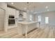 Gourmet kitchen with a central island, stainless appliances, and a view of the backyard at 428 Hatcher Ct, Hampton, GA 30228