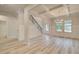 Spacious living area with staircase, coffered ceiling, and paneled walls at 428 Hatcher Ct, Hampton, GA 30228
