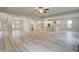 Spacious open floor plan connecting the living, dining, and kitchen areas with light-colored flooring at 428 Hatcher Ct, Hampton, GA 30228