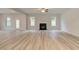 Bright living room with fireplace and light wood flooring at 428 Hatcher Ct, Hampton, GA 30228